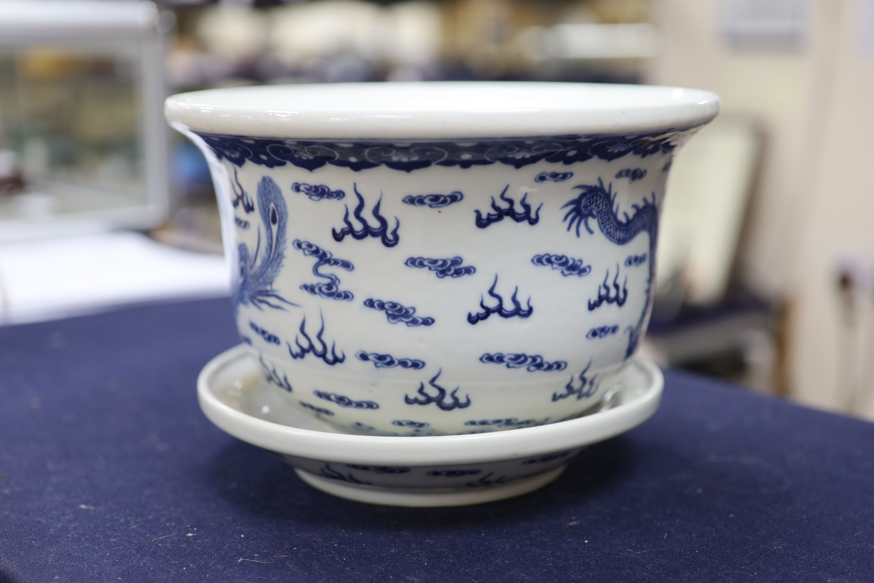 A 19th century Chinese porcelain jardiniere on stand